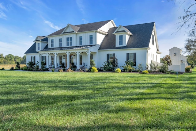 view of front of house with a porch and a front lawn