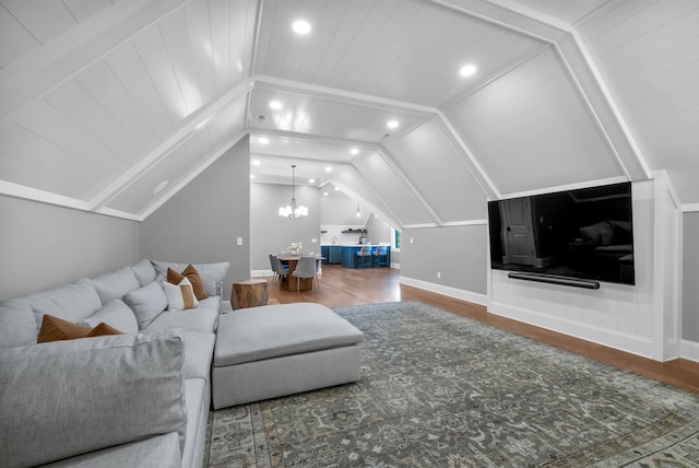 living room with a notable chandelier, wooden ceiling, lofted ceiling, and hardwood / wood-style flooring