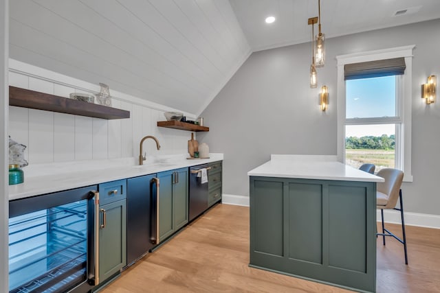 kitchen featuring light hardwood / wood-style flooring, beverage cooler, vaulted ceiling, and decorative light fixtures