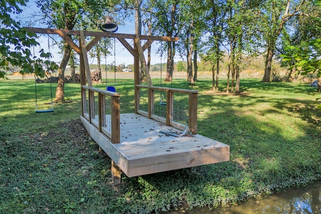 exterior space with a lawn and a water view