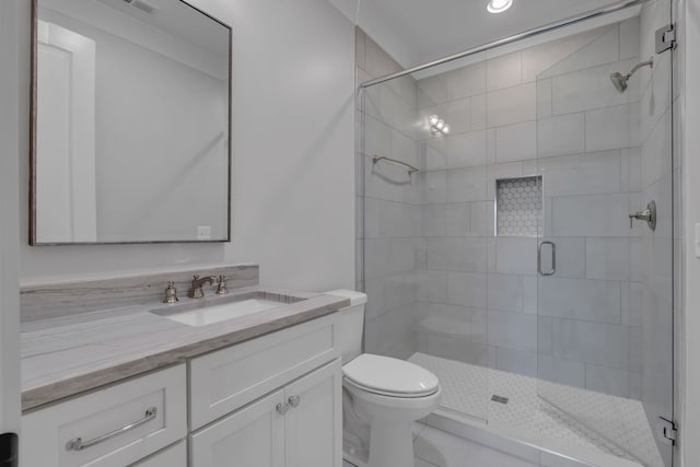 bathroom with tile patterned floors, walk in shower, vanity, and toilet