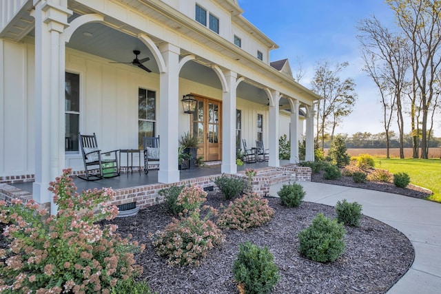 doorway to property with ceiling fan and a porch