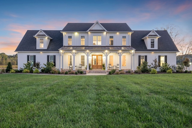 view of front of home with a yard