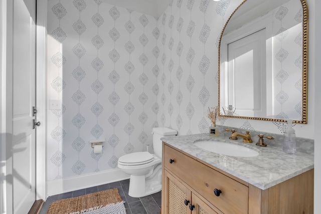 bathroom featuring vanity, tile patterned flooring, and toilet