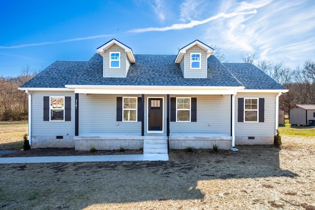 view of front facade featuring crawl space, a shingled roof, and a porch