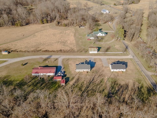 birds eye view of property with a rural view