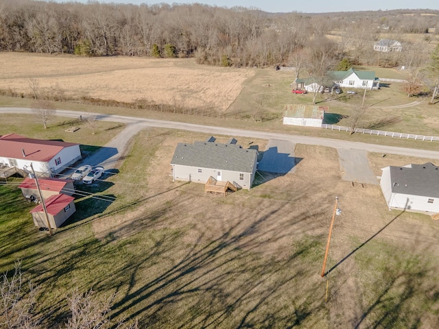 birds eye view of property with a rural view