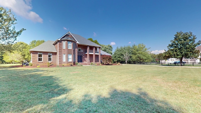 view of front of home with a front lawn