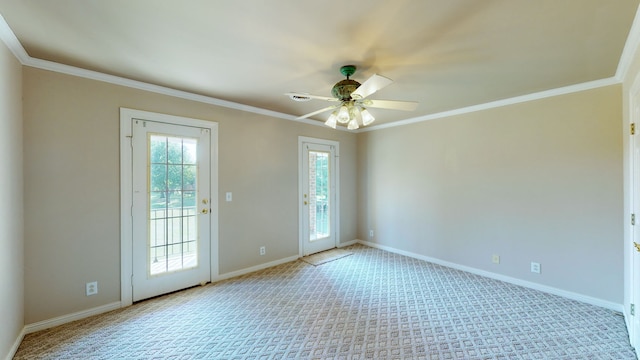 spare room with ornamental molding, light carpet, and ceiling fan