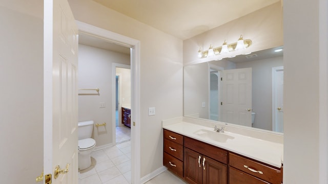 bathroom featuring vanity, toilet, and tile patterned floors