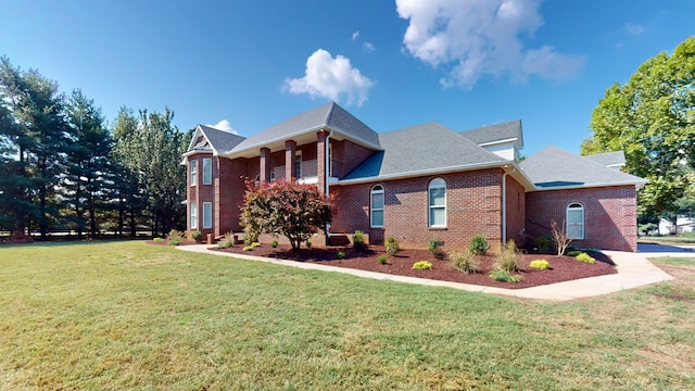 view of side of property with a yard