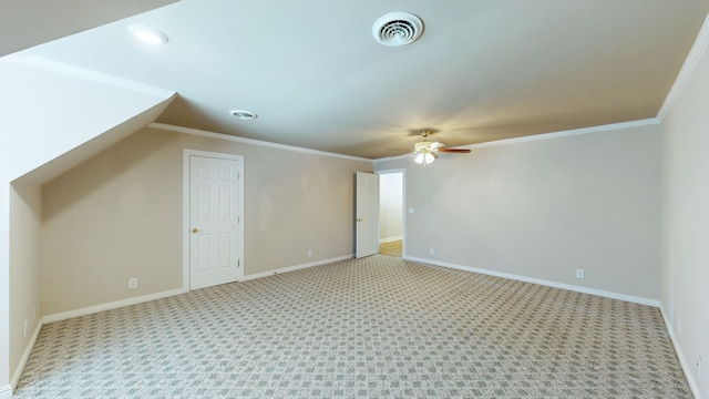 additional living space with ceiling fan and light colored carpet