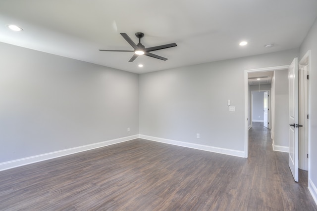 unfurnished room featuring ceiling fan and dark hardwood / wood-style floors