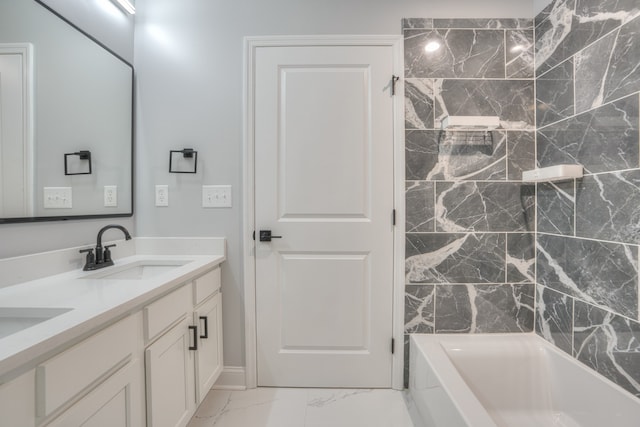 bathroom featuring vanity and a washtub