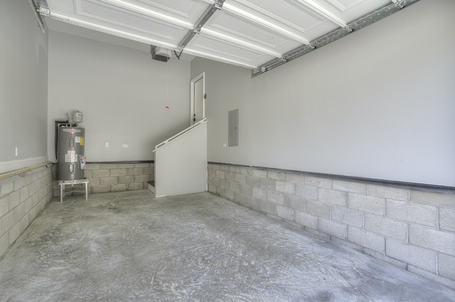 garage with a garage door opener, electric panel, and water heater