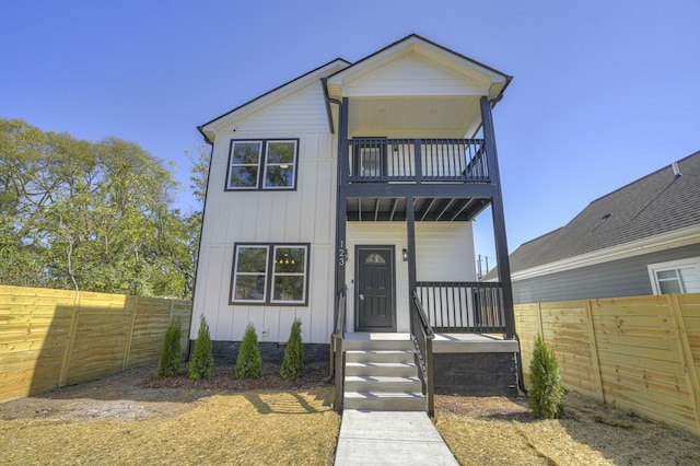 view of front of house with a balcony