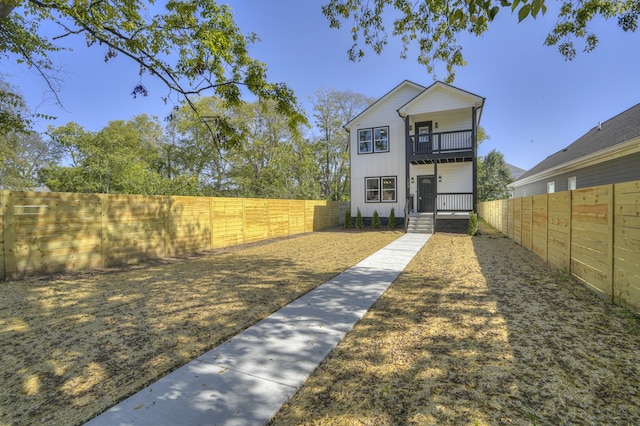 view of yard featuring a balcony