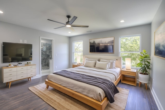 bedroom featuring ensuite bathroom, ceiling fan, and dark wood-type flooring