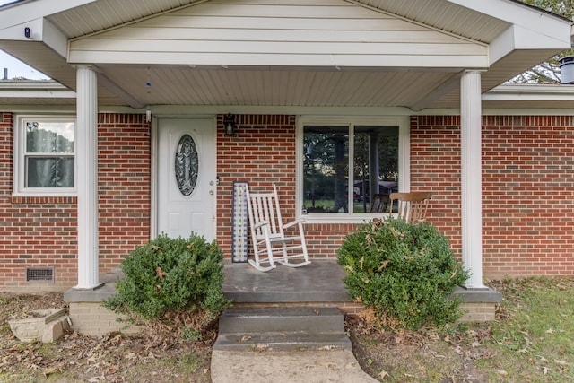 view of exterior entry featuring a porch