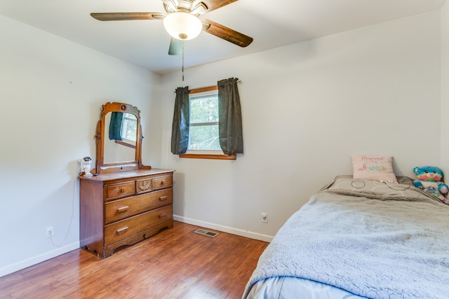 bedroom featuring wood-type flooring and ceiling fan