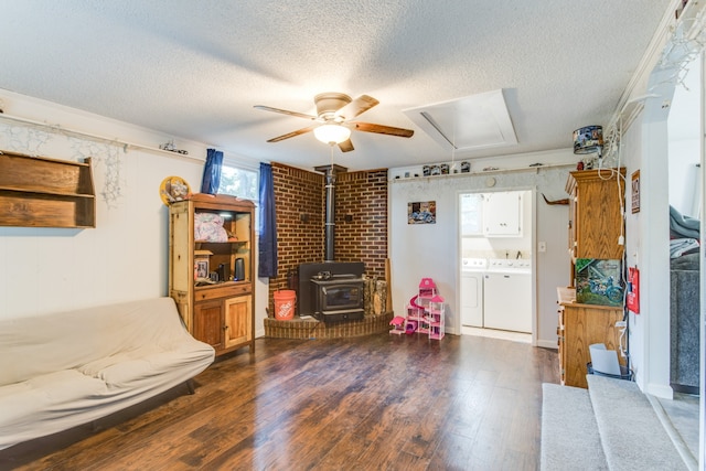 misc room with a textured ceiling, wood-type flooring, separate washer and dryer, and plenty of natural light