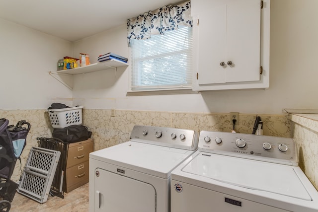 laundry area featuring cabinets and separate washer and dryer