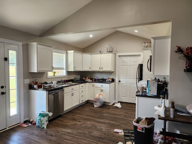 kitchen with vaulted ceiling, appliances with stainless steel finishes, plenty of natural light, and dark wood-type flooring