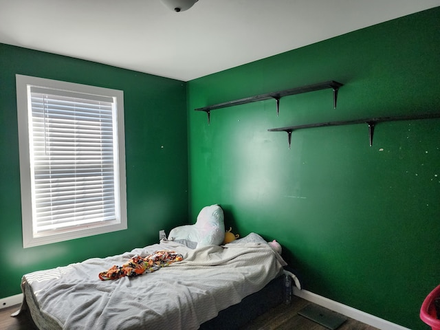 bedroom featuring wood-type flooring