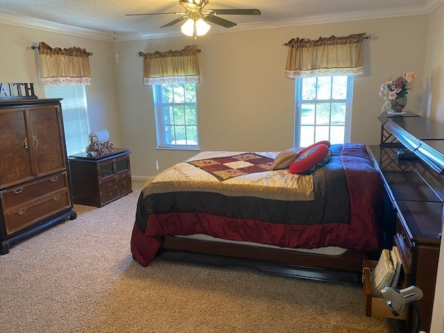 bedroom with multiple windows, carpet flooring, ornamental molding, and ceiling fan