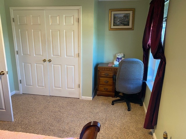 office area featuring light colored carpet