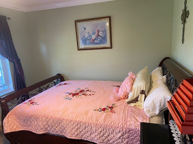 bedroom with ornamental molding