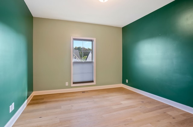 unfurnished room featuring light hardwood / wood-style flooring