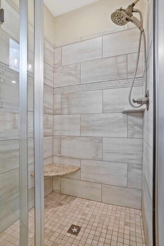 bathroom with a tile shower