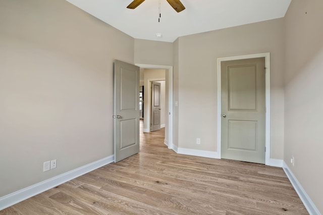 unfurnished bedroom featuring ceiling fan and light hardwood / wood-style flooring