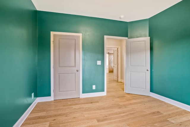 spare room with light hardwood / wood-style flooring