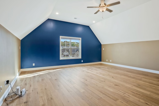 bonus room featuring light hardwood / wood-style floors, lofted ceiling, and ceiling fan