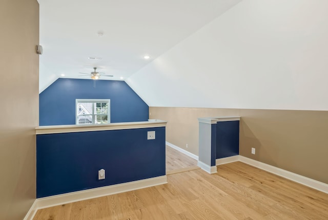 bonus room with lofted ceiling, ceiling fan, and hardwood / wood-style flooring