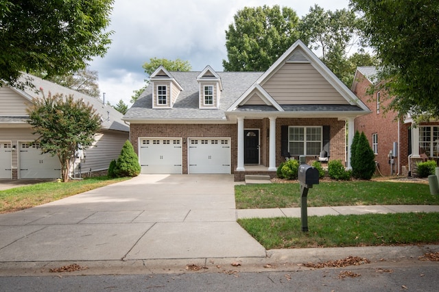 view of front of property featuring covered porch and a garage