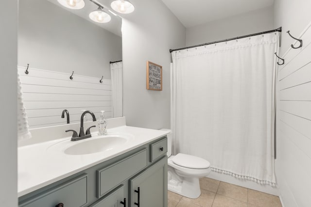 bathroom featuring vanity, tile patterned flooring, toilet, and a shower with shower curtain