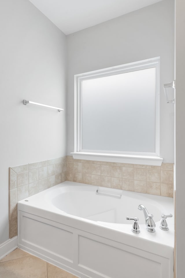 bathroom featuring tile patterned floors and a bathtub