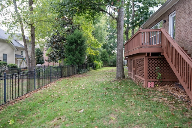 view of yard with a wooden deck