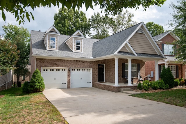 view of front of house featuring a front yard and a garage