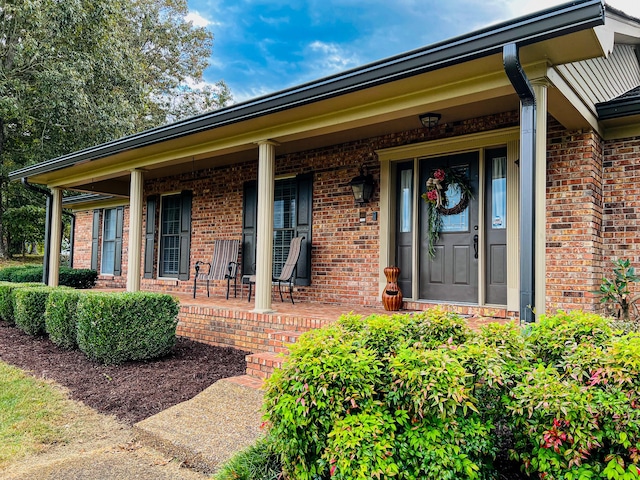 entrance to property with covered porch