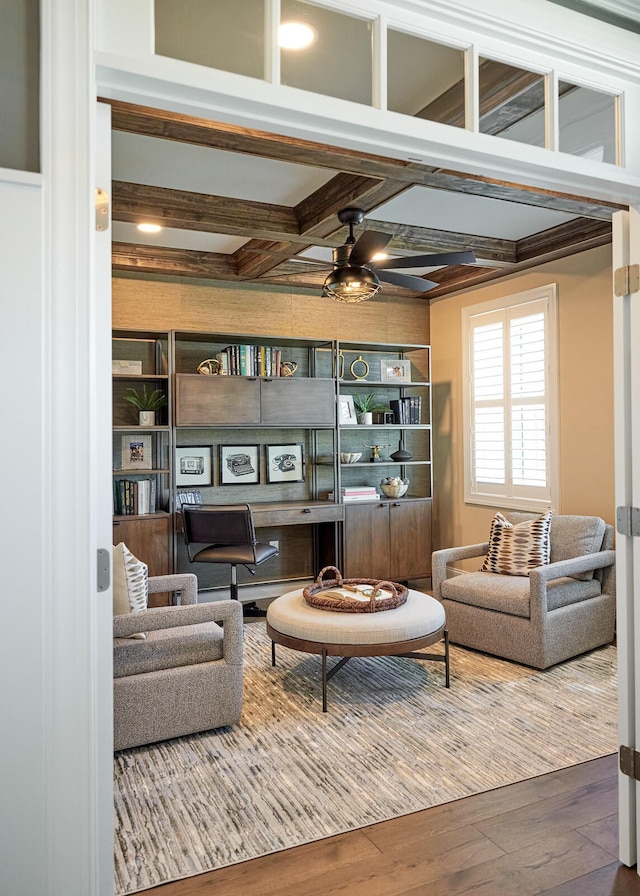 living room with wood-type flooring, beamed ceiling, and coffered ceiling