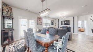 dining space with wood-type flooring and an inviting chandelier