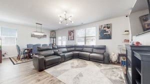 living room with a chandelier and light hardwood / wood-style floors