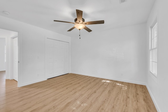 unfurnished room featuring light hardwood / wood-style flooring and ceiling fan