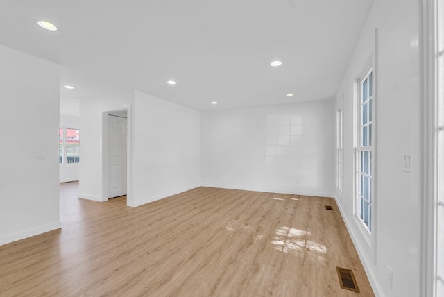 spare room with light wood-type flooring