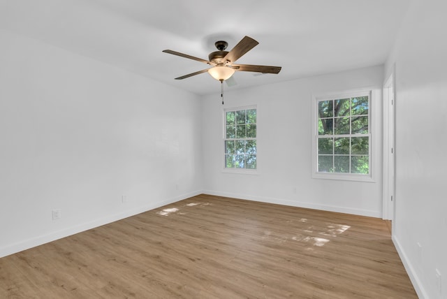 unfurnished room featuring light wood-type flooring and ceiling fan