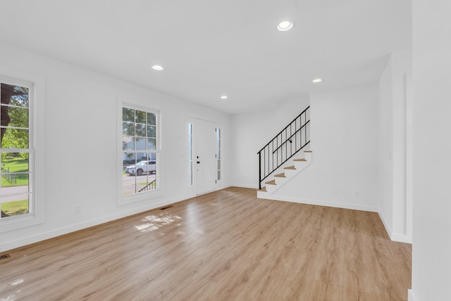 foyer entrance featuring light hardwood / wood-style flooring and plenty of natural light